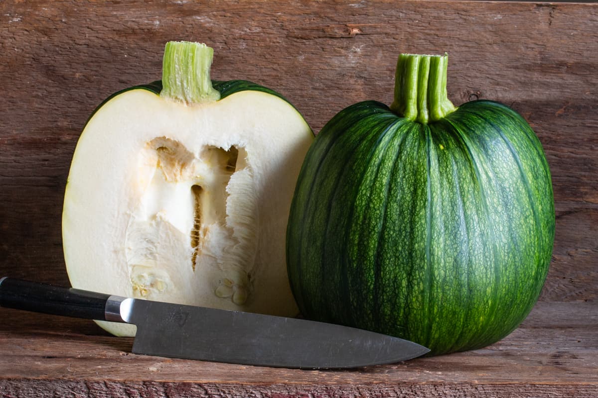 Green pumpkin cut in half 
