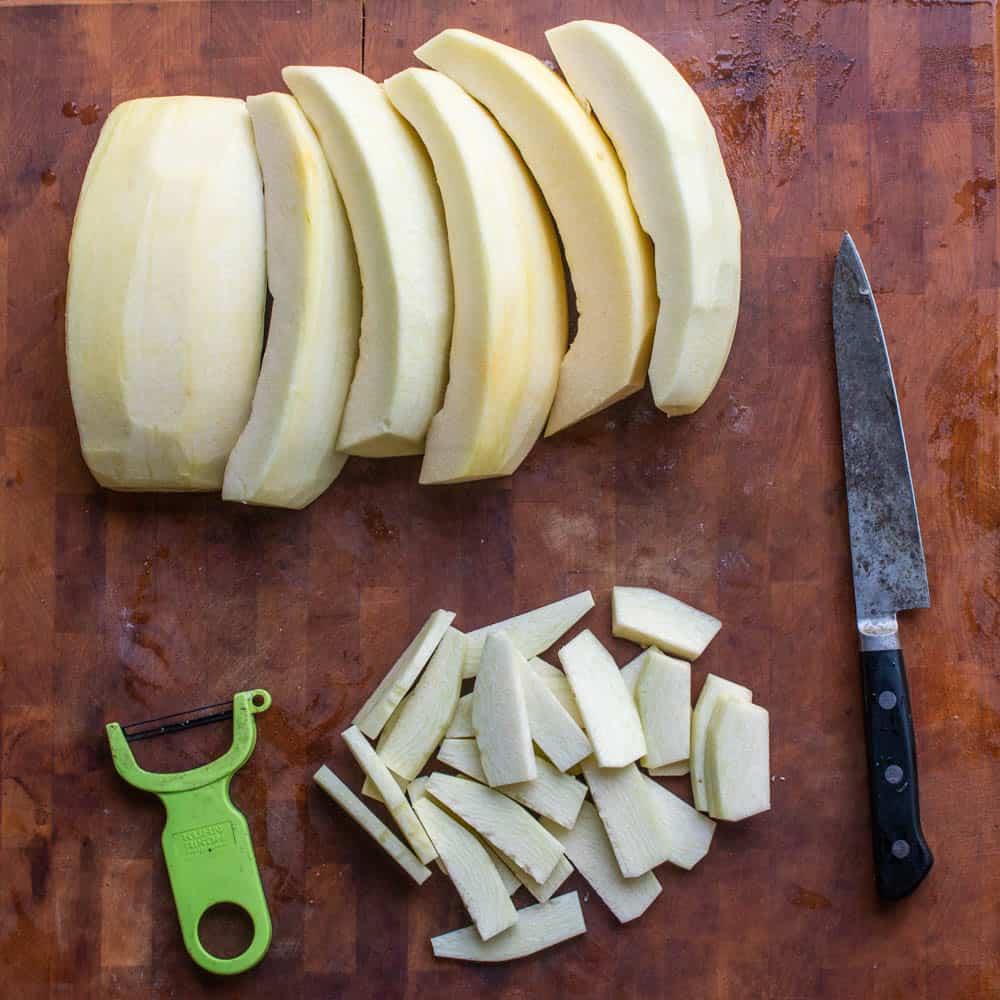 cuttting green unripe pumpkin for mock apple pie 