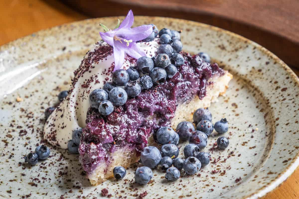 Wild blueberry-hazelnut upside down cake with meadowsweet cream