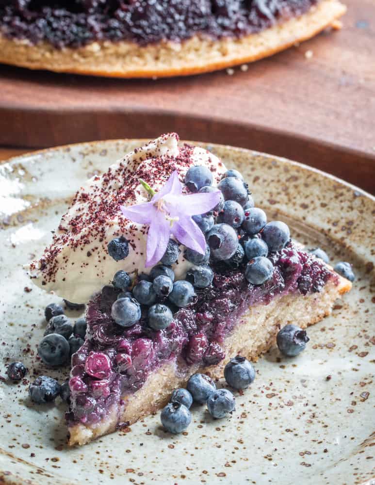 Wild blueberry-hazelnut upside down cake with meadowsweet cream 