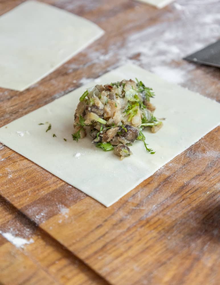 Filling chebureki with wild mushroom filling