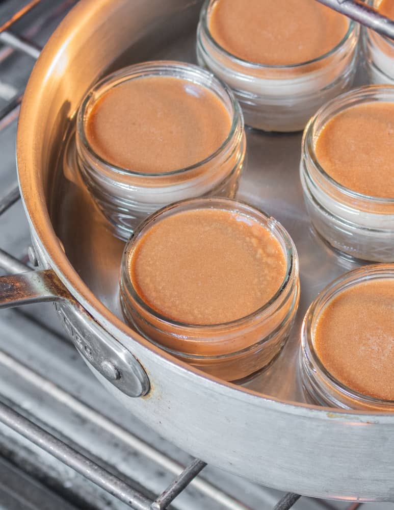 cooked shagbark hickory nut pot du creme in a water bath in jelly jars