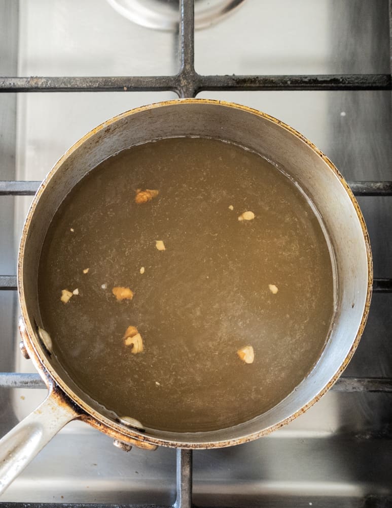 cooking crushed hickory nuts in a pot to make tea 