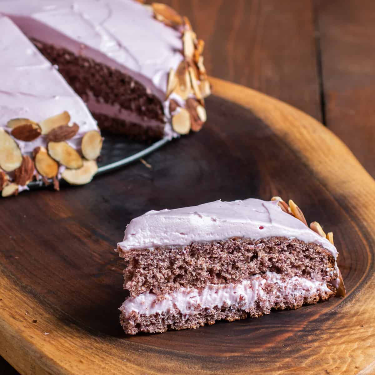 a double layer purple cake made with cherry flour with cream cheese frosting