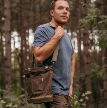 chef alan bergo outside with a mushroom hunting bag