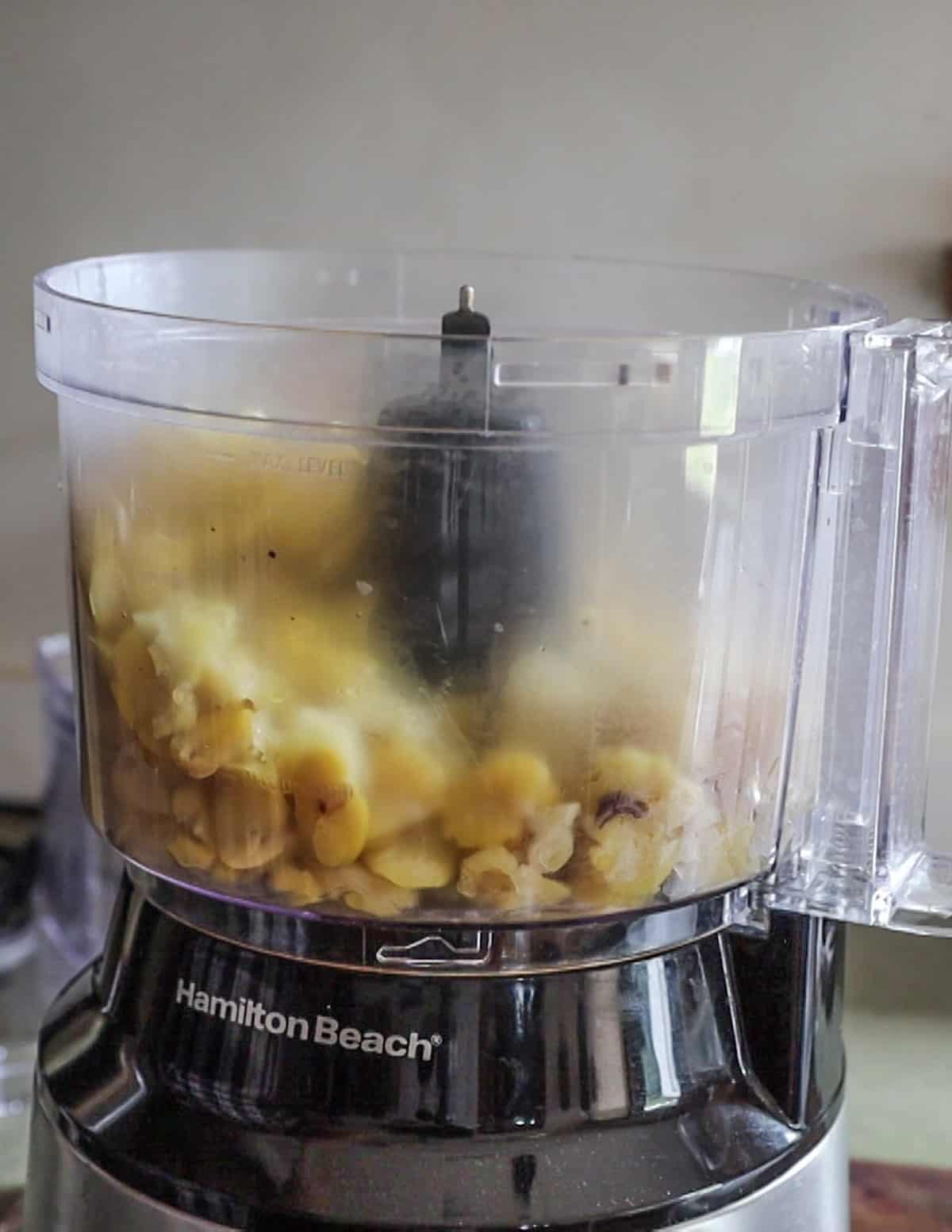 pureeing fava beans in a food processor