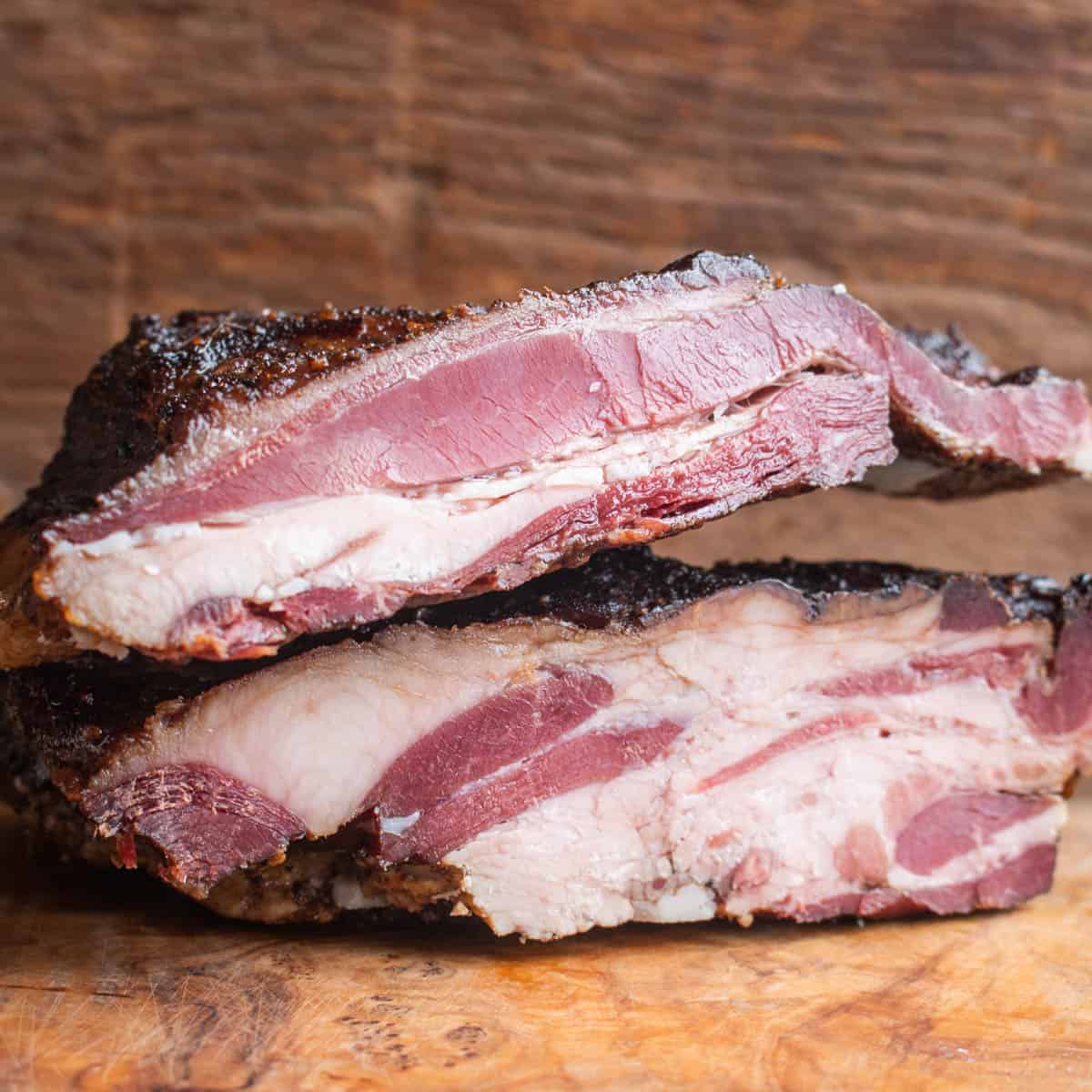 homemade bacon sliced in half 