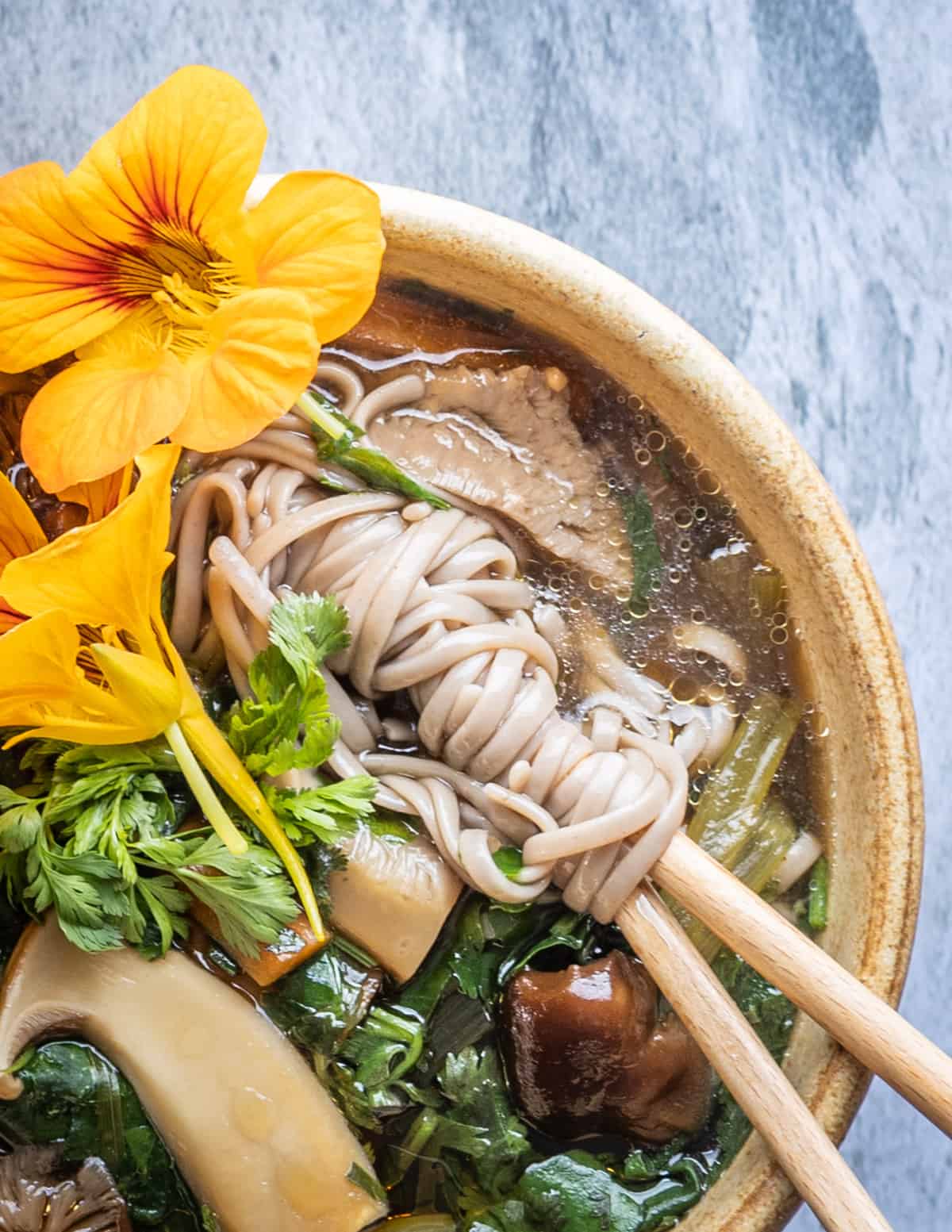 twirling soba noodles in a bowl