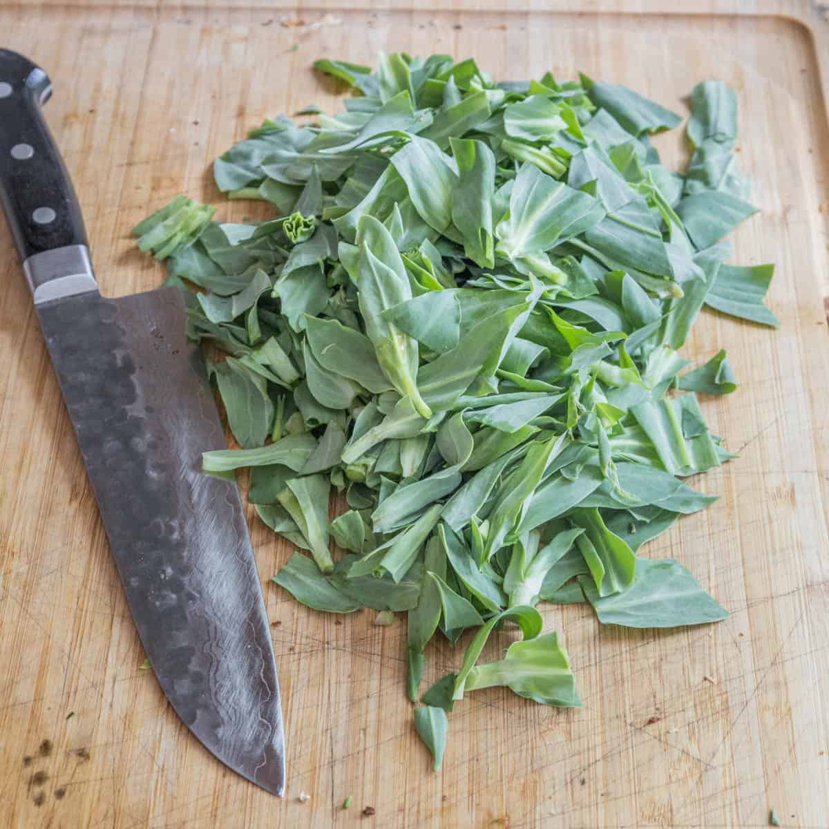 cut campion greens on a board 