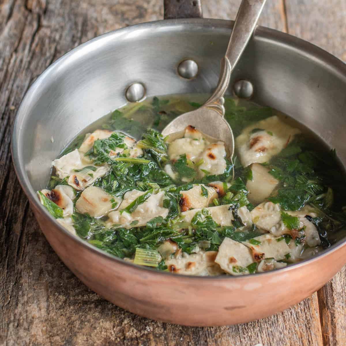 A pan of gazpacho vuido Spanish soup made with campion greens. 