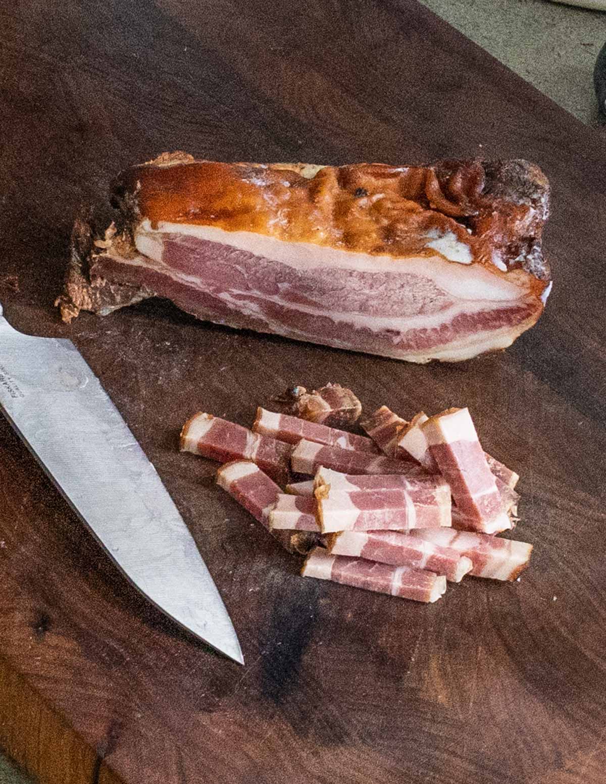 cutting homemade bacon