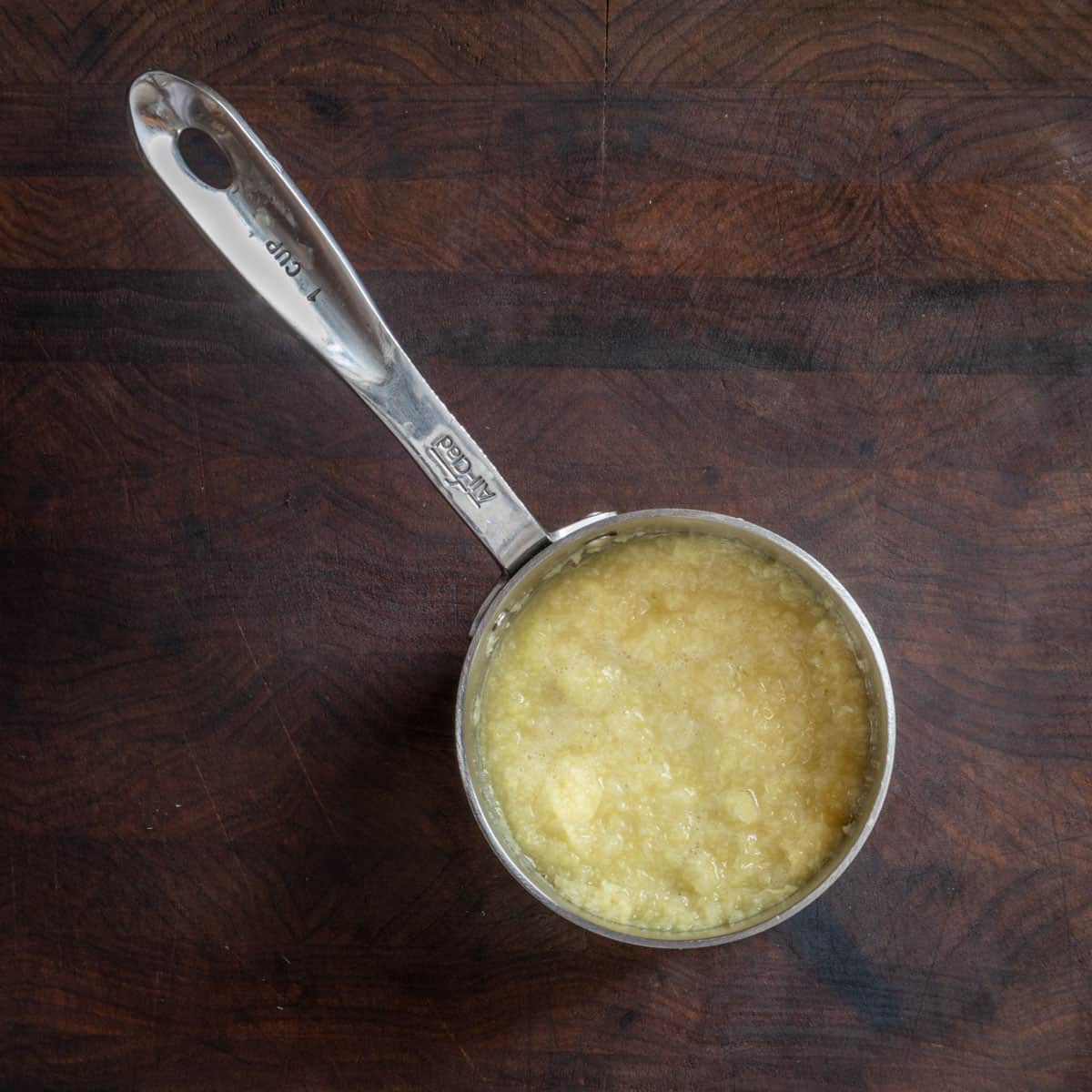 ginger garlic paste in a measuring spoon