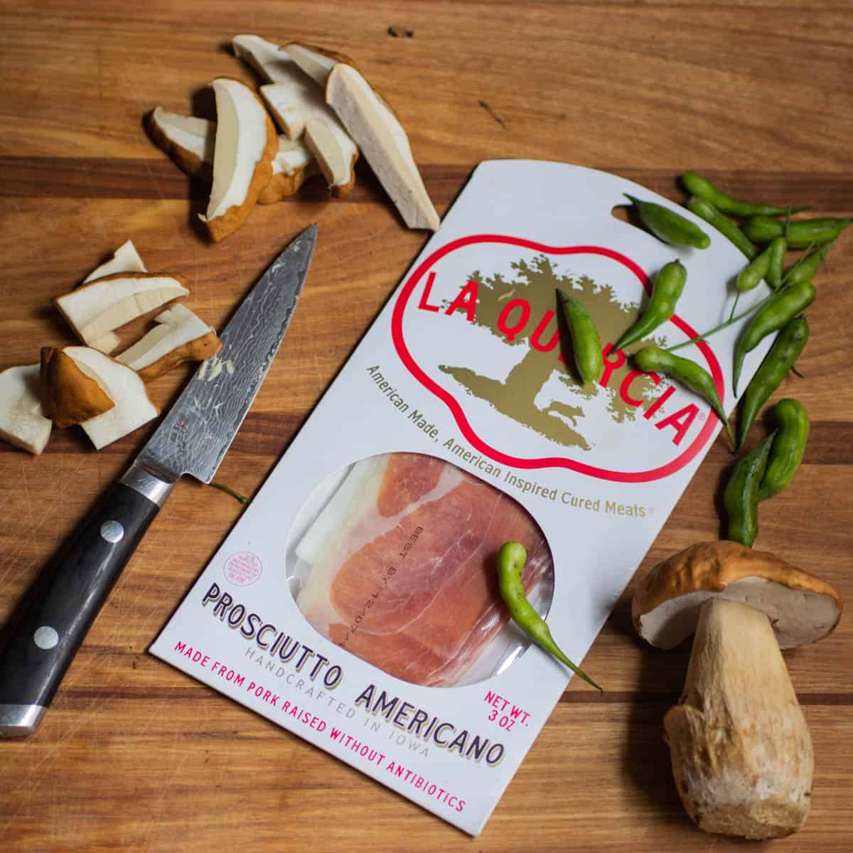 prosciutto in a package with mushrooms and rat tail radishes