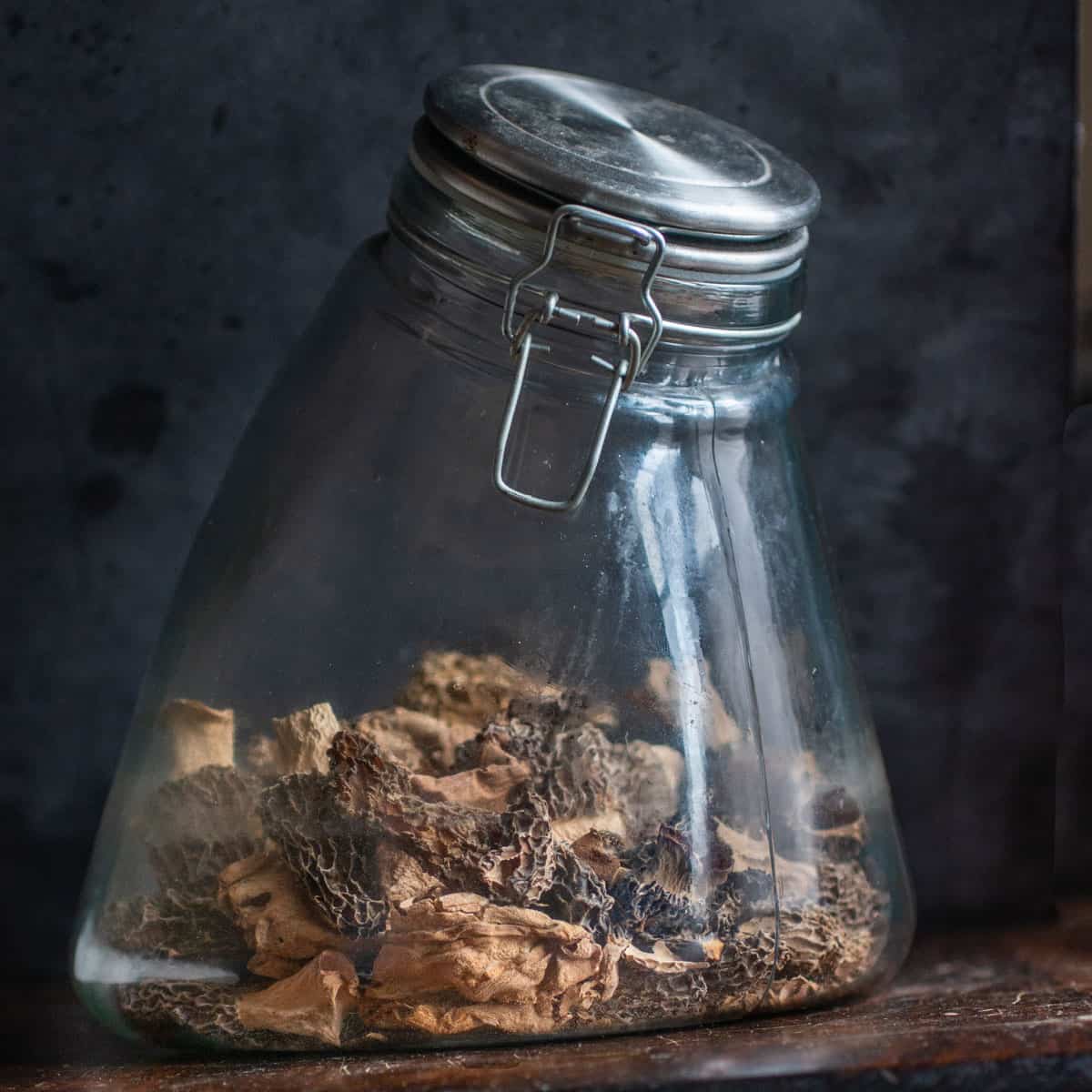 dried morel mushrooms in a jar