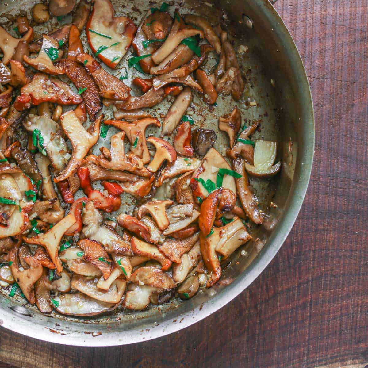 cut mushrooms cooking in a pan 