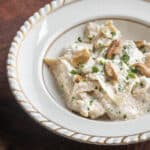 ravioli in a bowl with walnut sauce