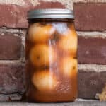 Spiced pickled crab apples in a jar