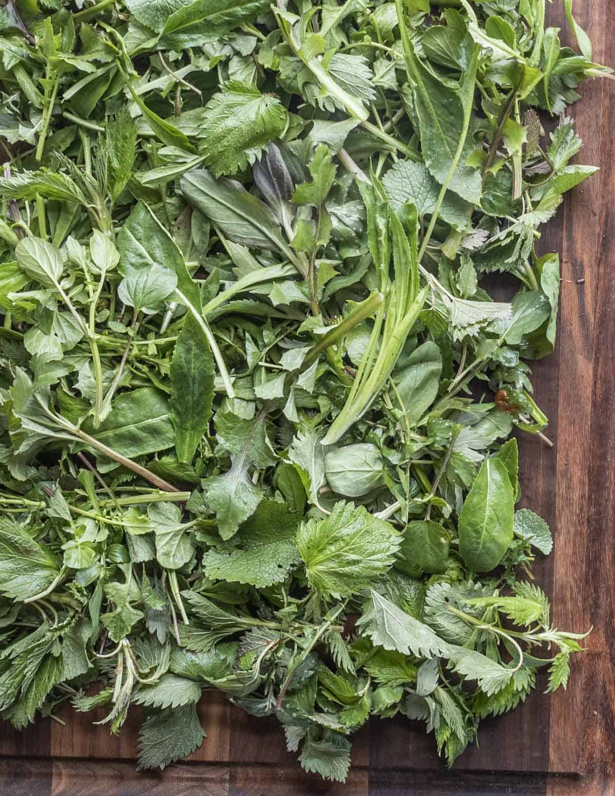 a mix of many wild plants on a board 