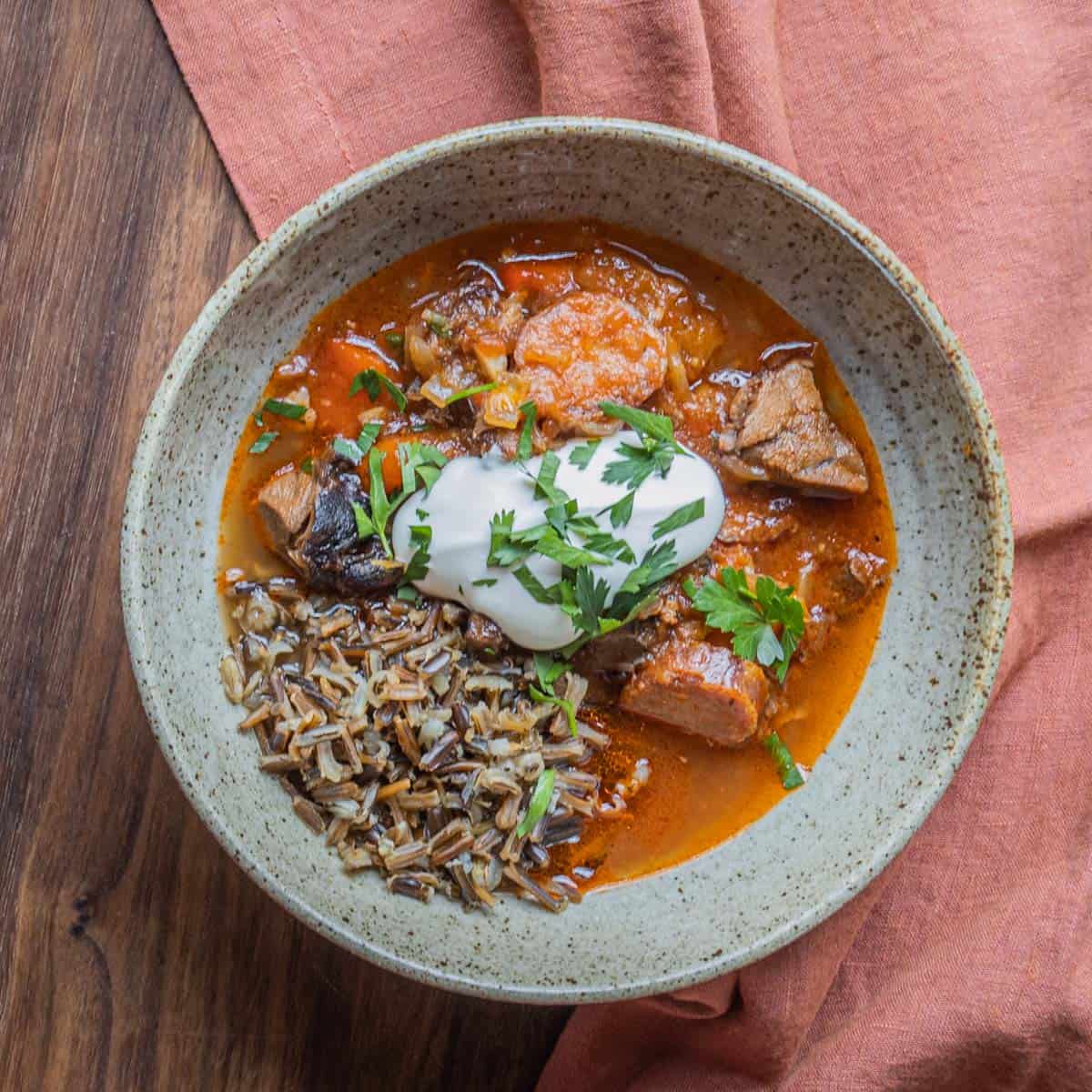 a bowl of lamb and sauerkraut stew with wild rice. 