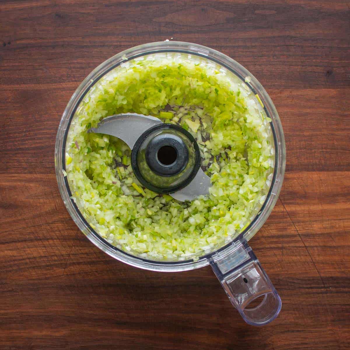 grinding vegetables in a food processor