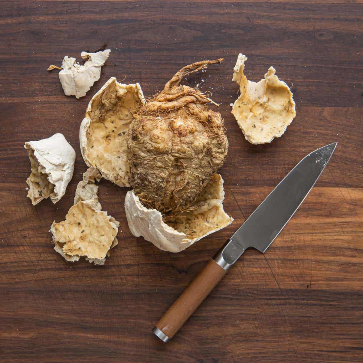 removing celeriac steak from a pastry crust