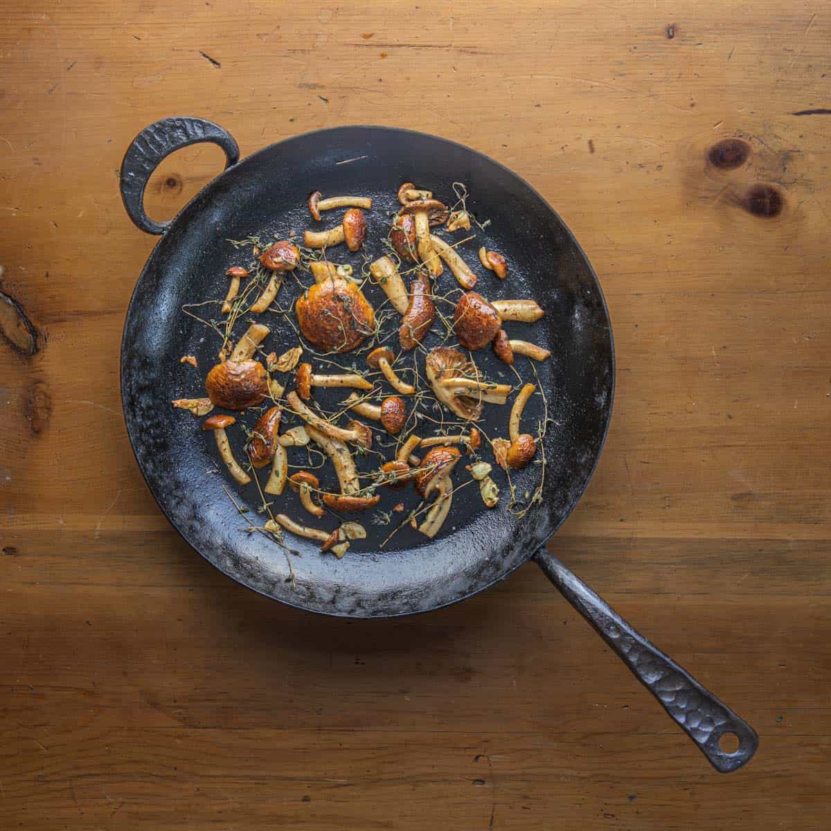 roasted chestnut mushrooms in a carbon steel pan 