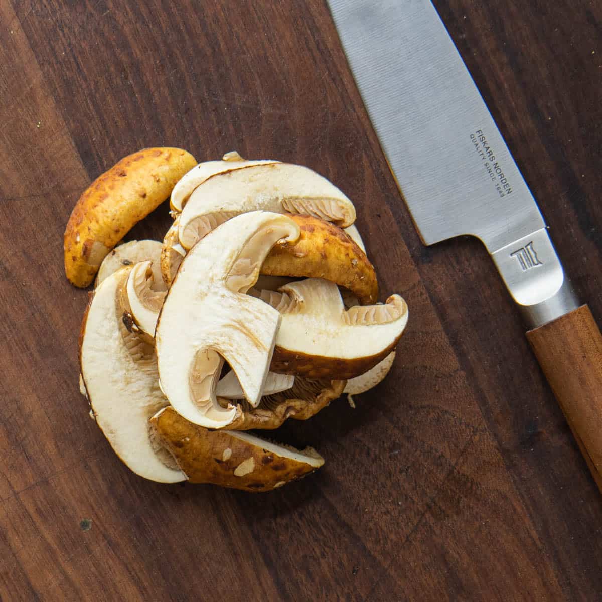 cutting chestnut mushrooms with a fiskars knife 