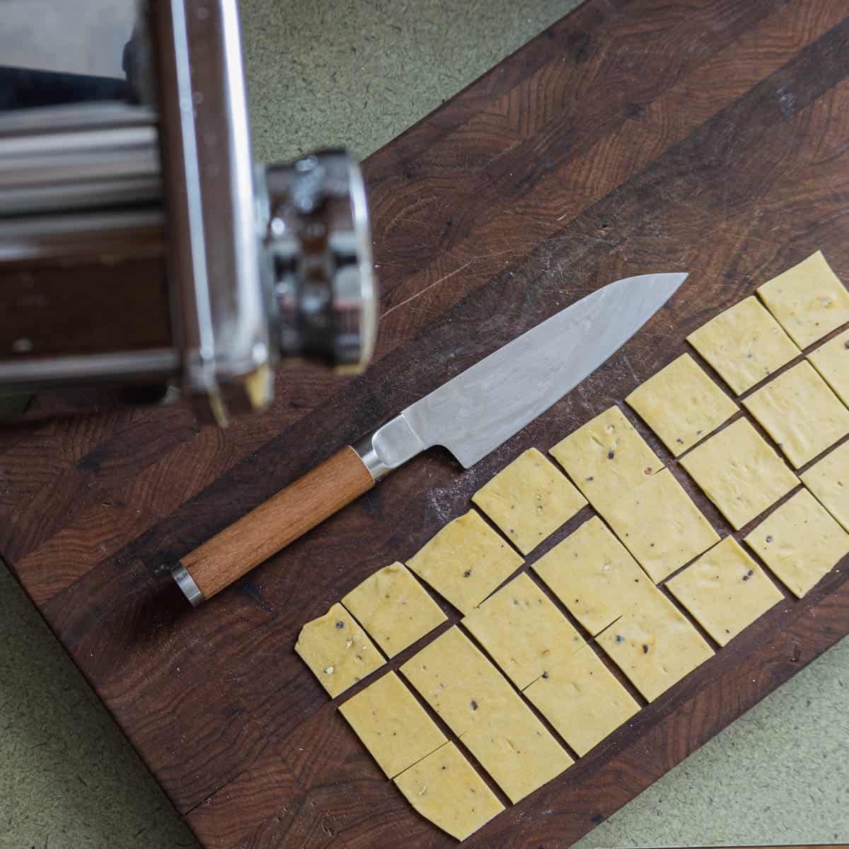 cutting fresh homemade polish lazanki pasta.