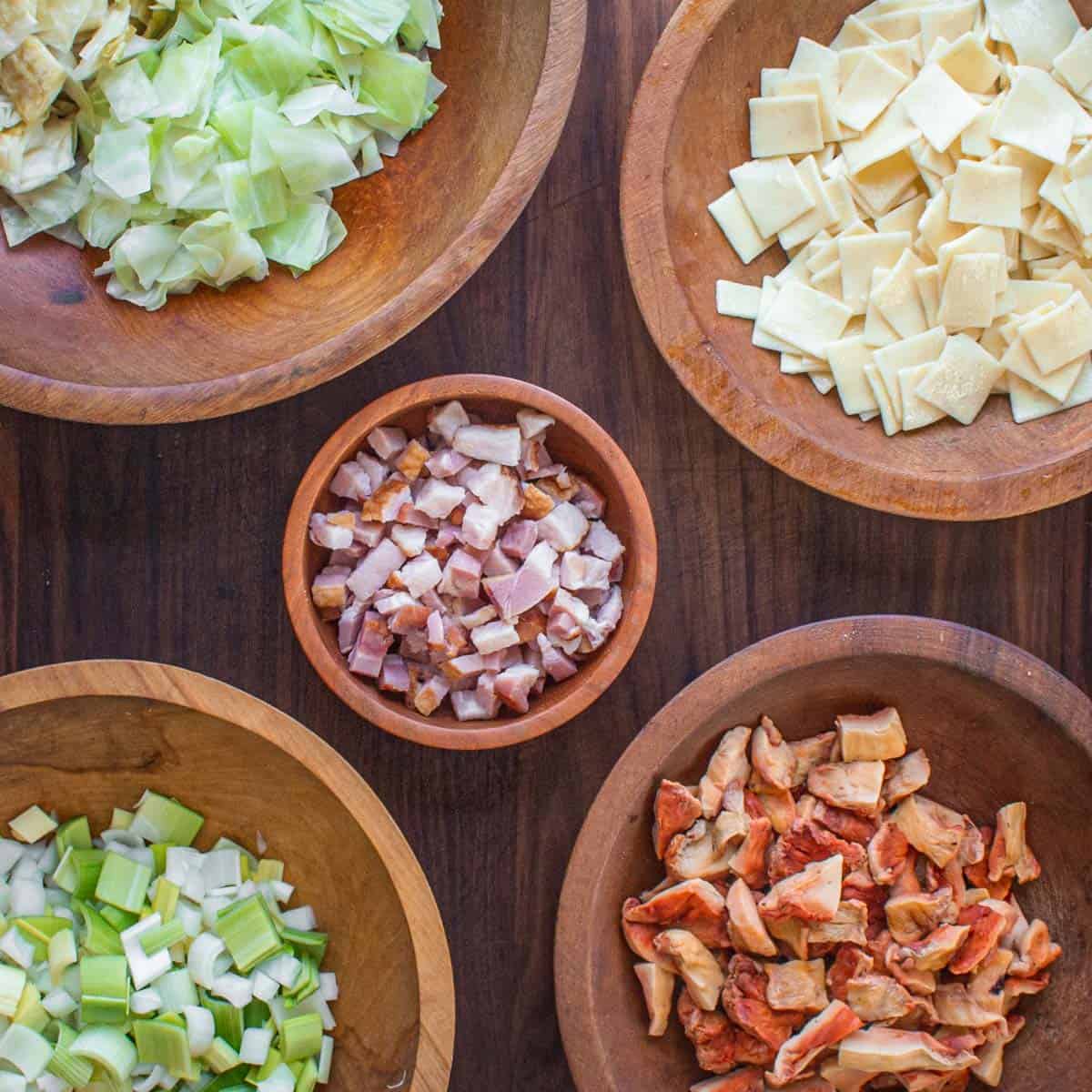 ingredients for polish lazanki pasta: cabbage, sauerkraut, bacon, mushrooms and onions