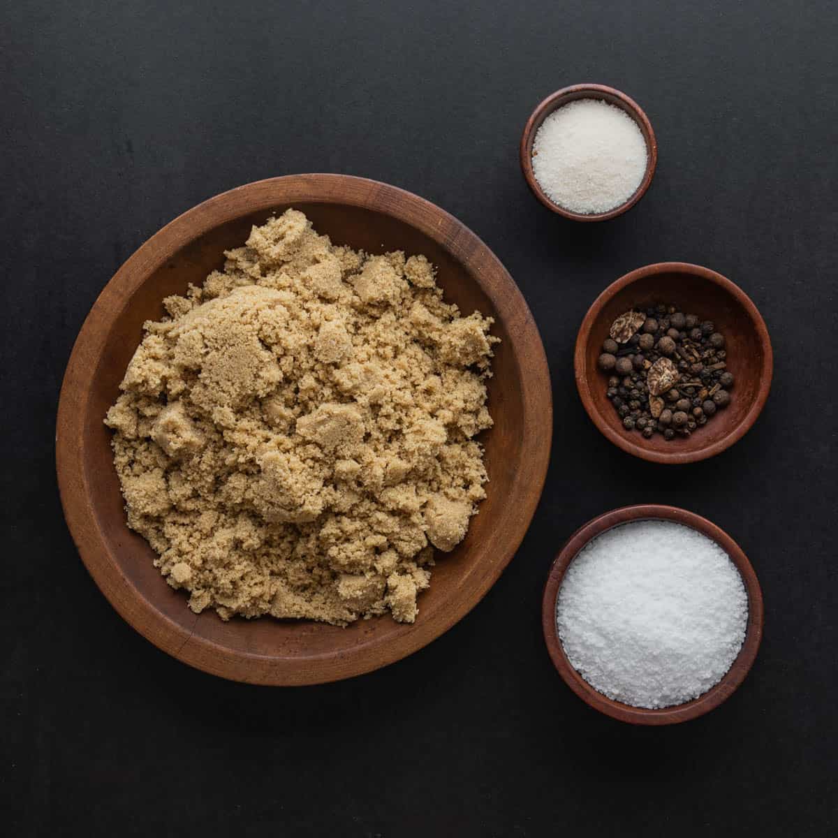 Beef bacon ingredients: salt, brown sugar, spices and curing salt in a bowl. 