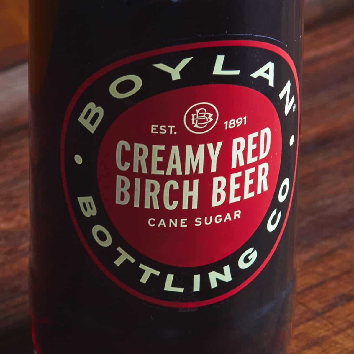 A close up of the label on a bottle of birch beer.