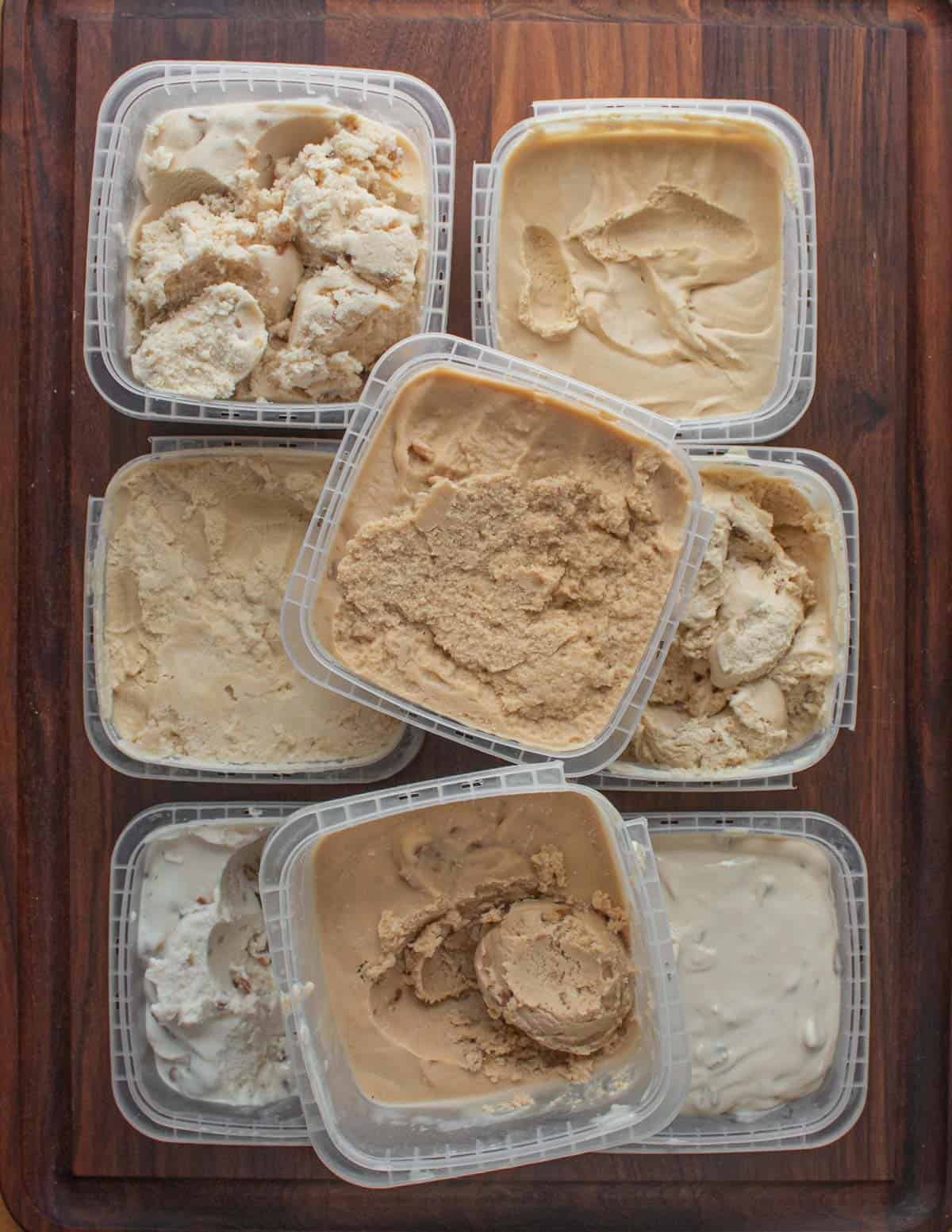 8 containers containing different versions of black walnut ice cream