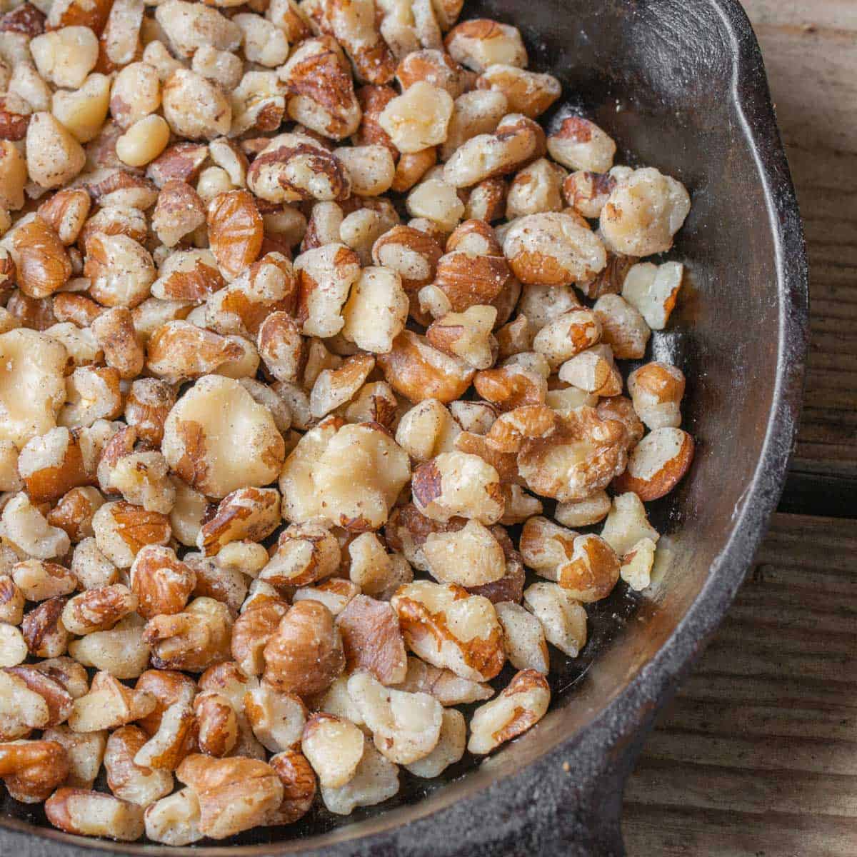 Black walnut pieces in a pan.