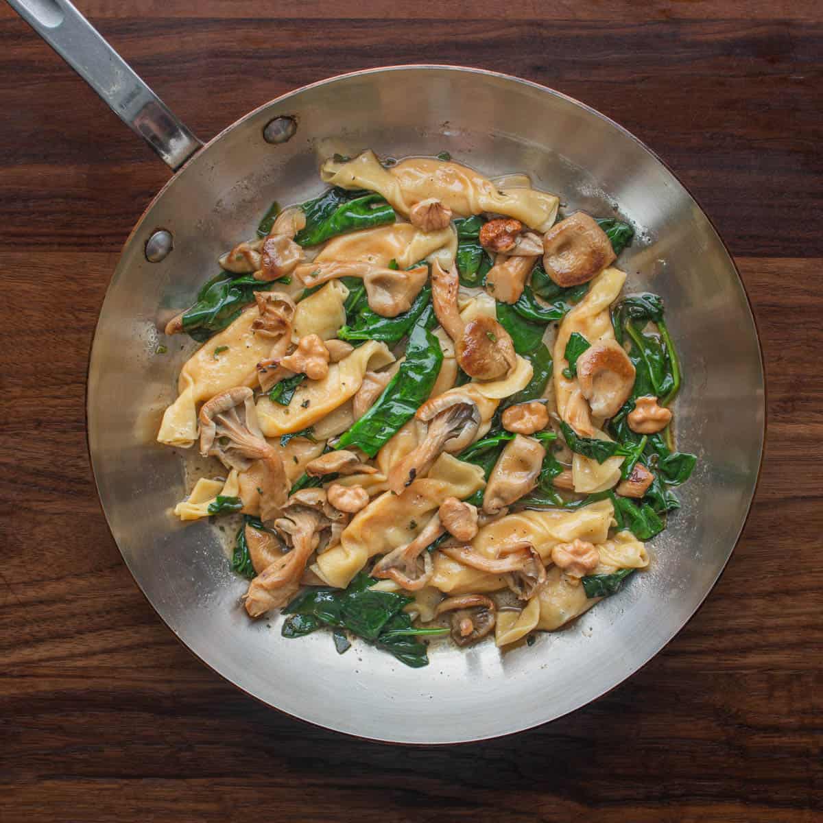 Caramelle pasta with brown butter, spinach and mushrooms