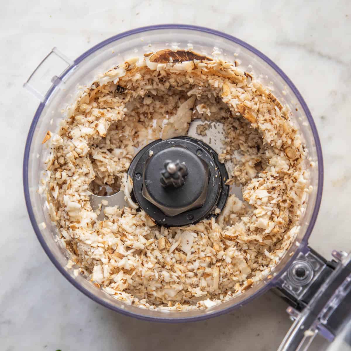 grinding dryad saddle mushrooms in a food processor.