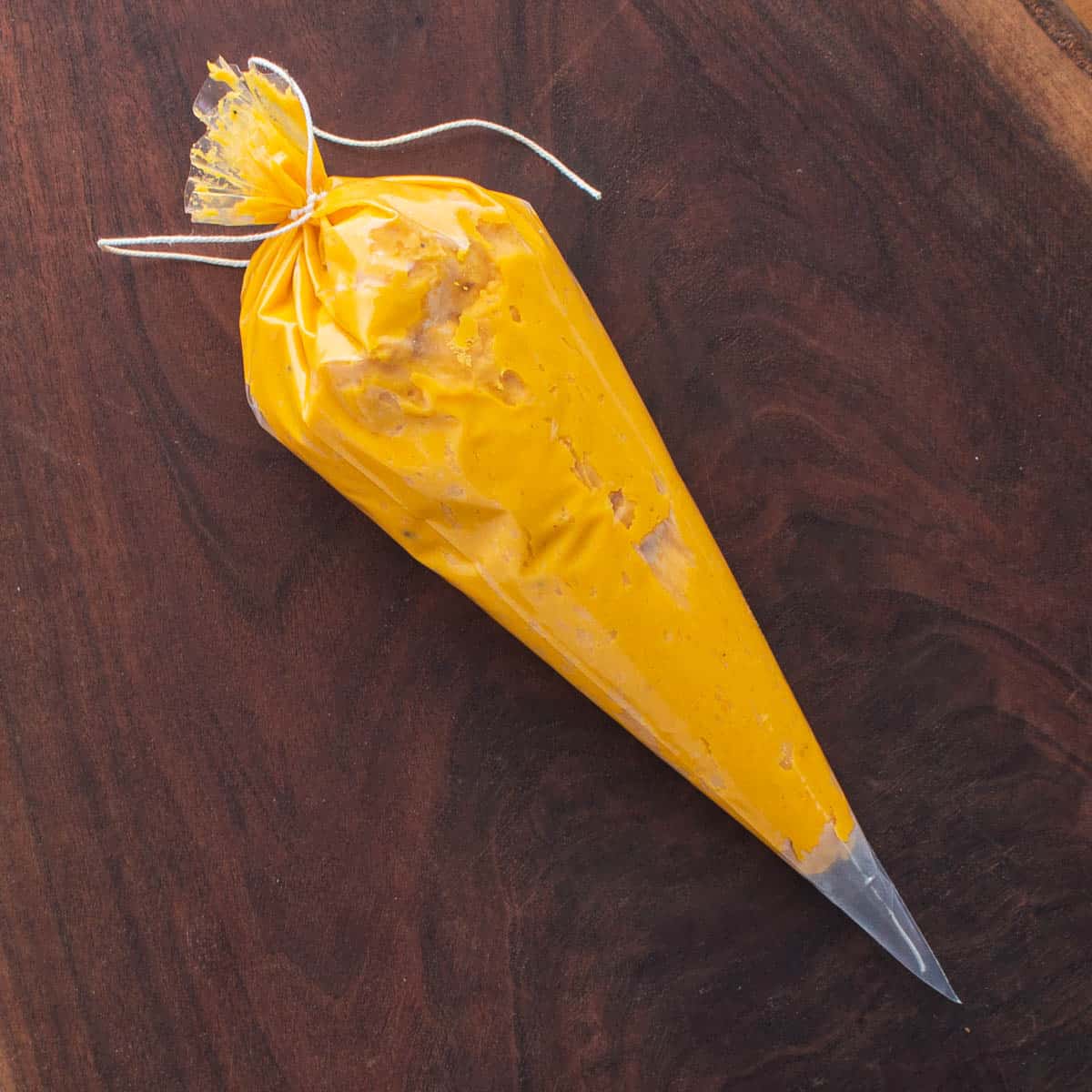 A piping bag filled with squash filling