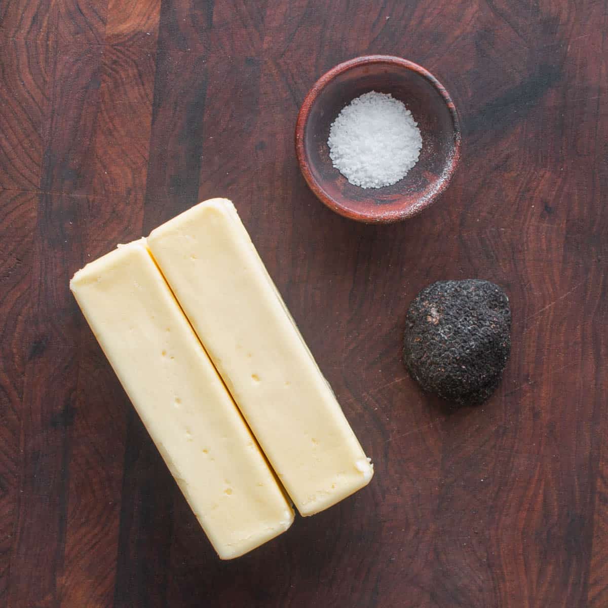 black truffle butter ingredients on a cutting board. 