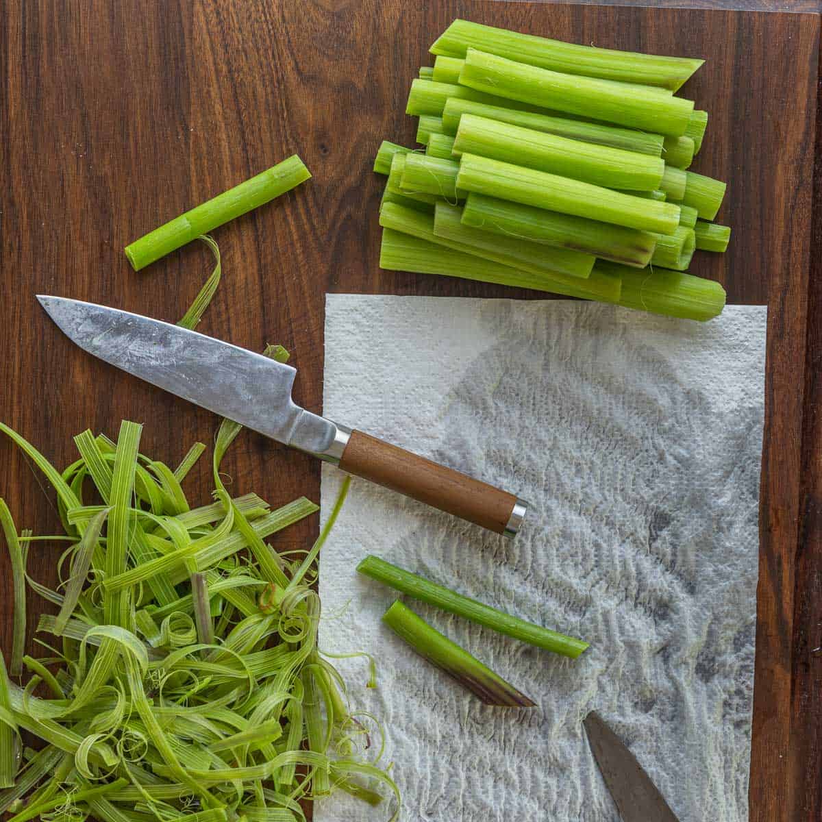 peeling angelica stems.