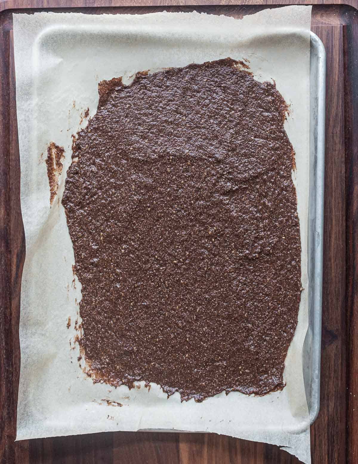 Drying a sheet of dock seed cracker paste. 