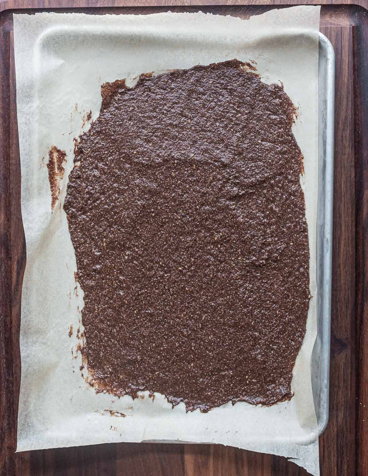 Drying a sheet of dock seed cracker paste.