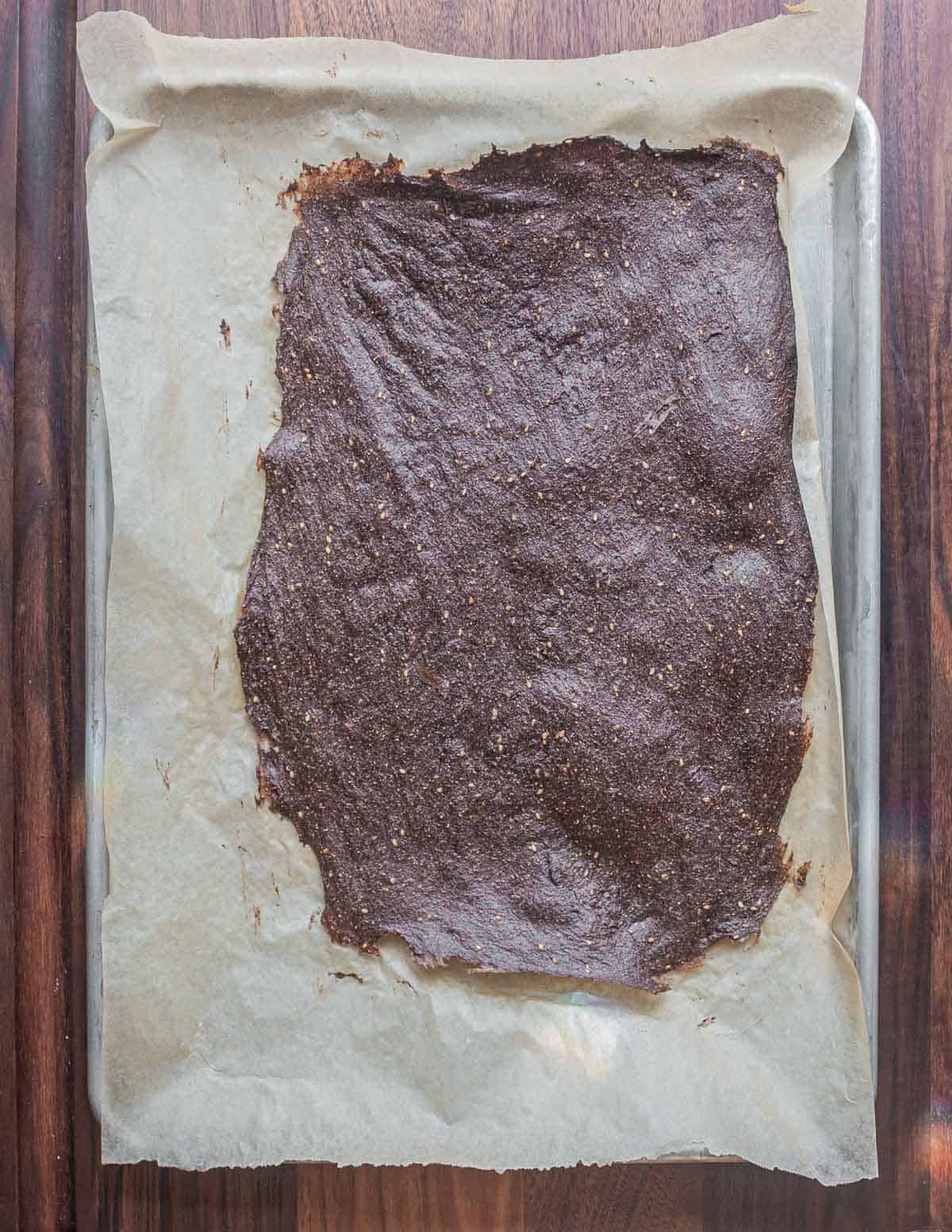 A dehydrated sheet of dock seed flour crackers.