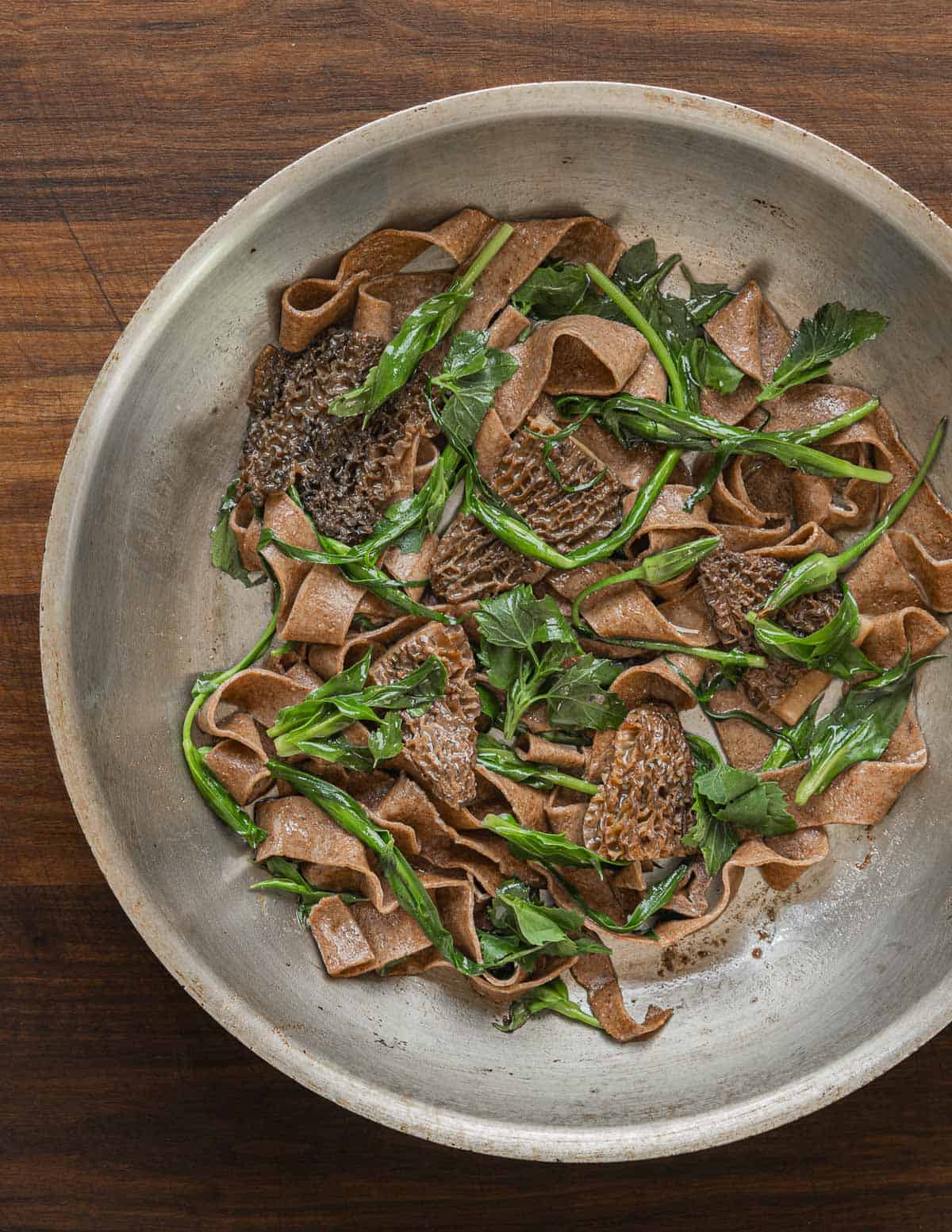 Dock seed pasta with morels, salsify tips, and lambs quarters. 