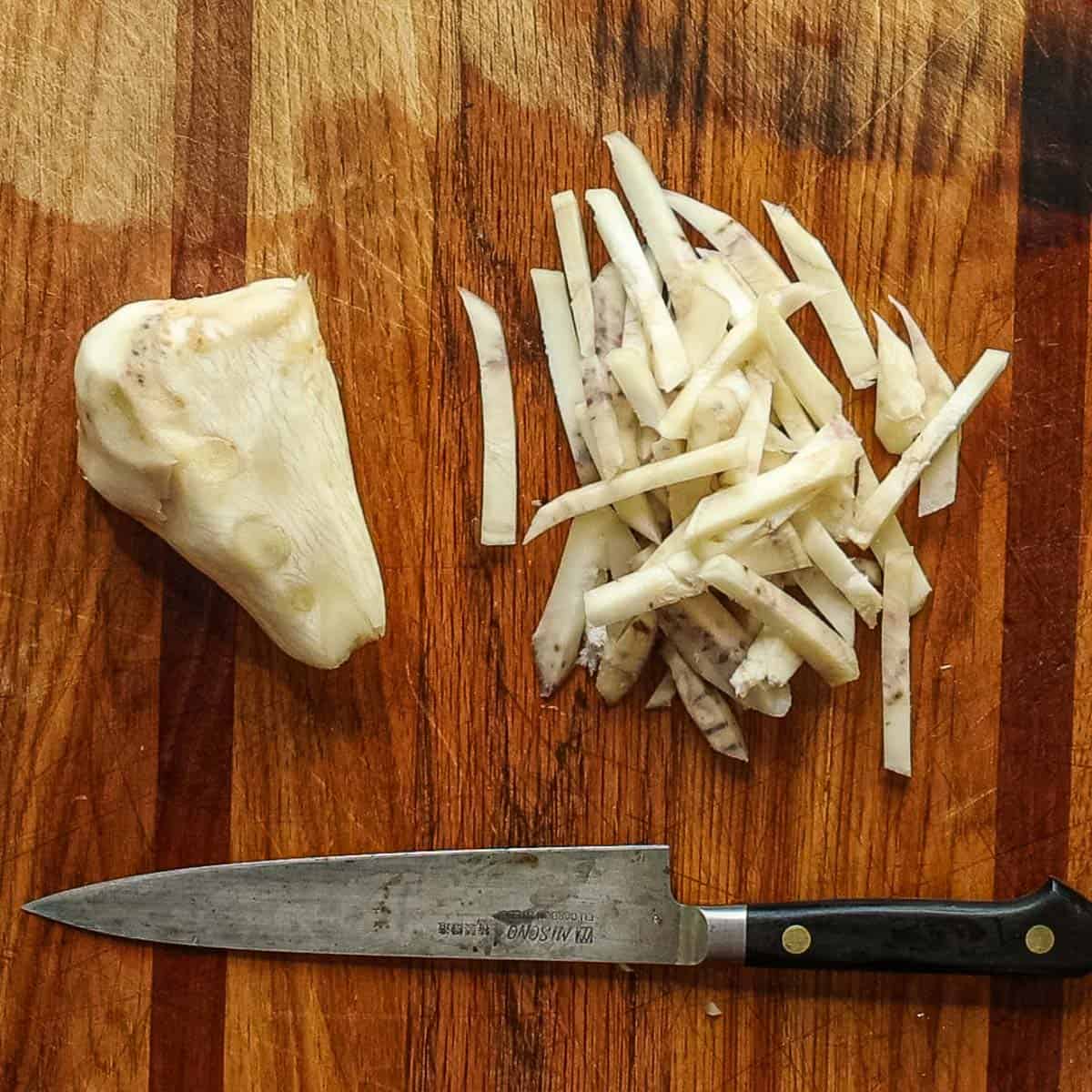 Cutting sliced thistle roots into matchsticks. 