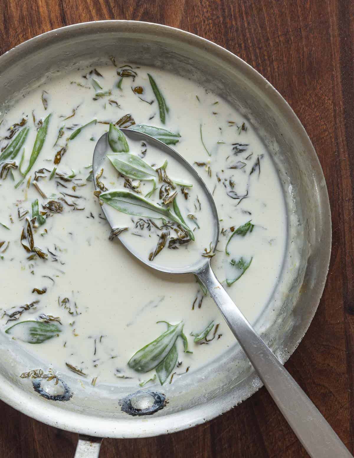 Making sorrel sauce in a pan.