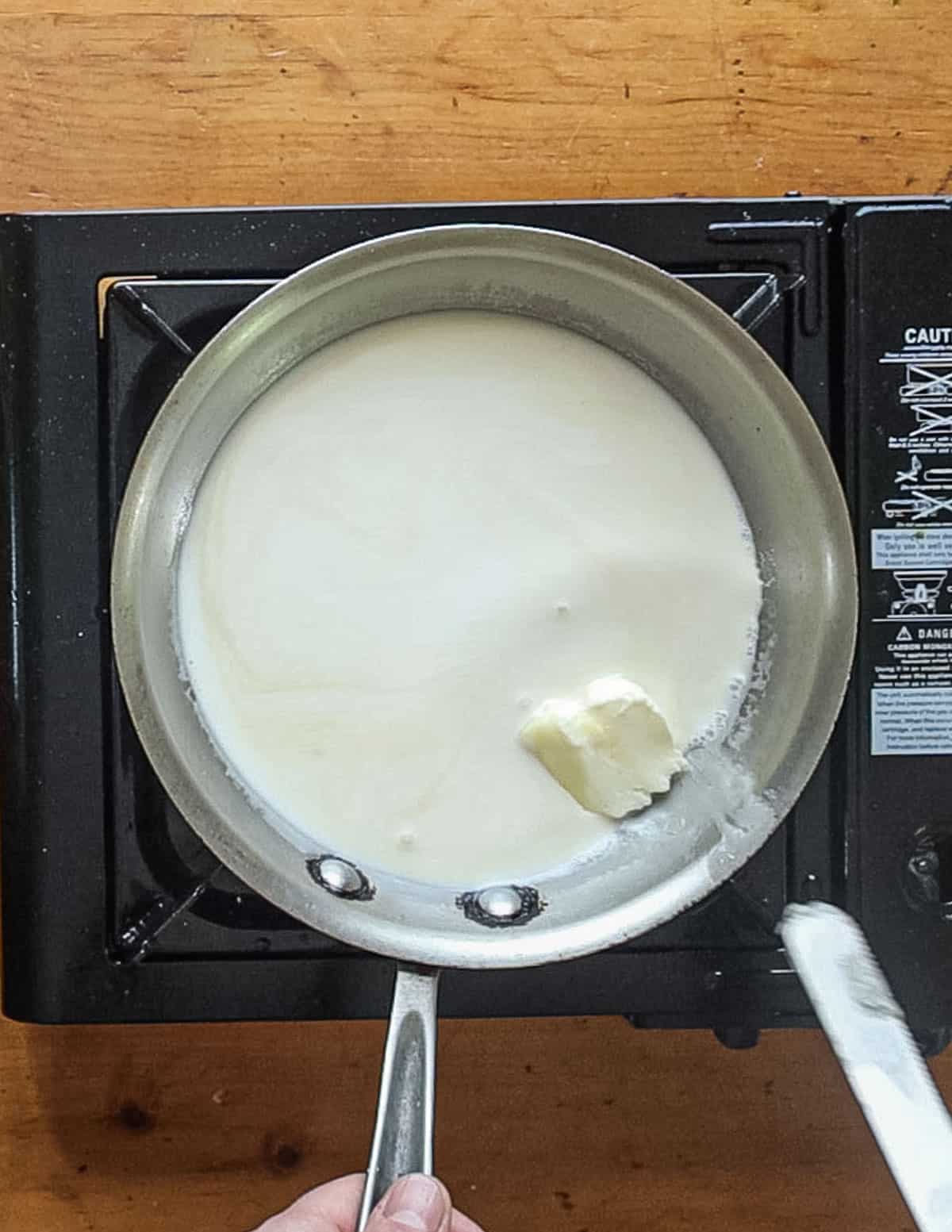 Adding butter to a reduction sauce. 