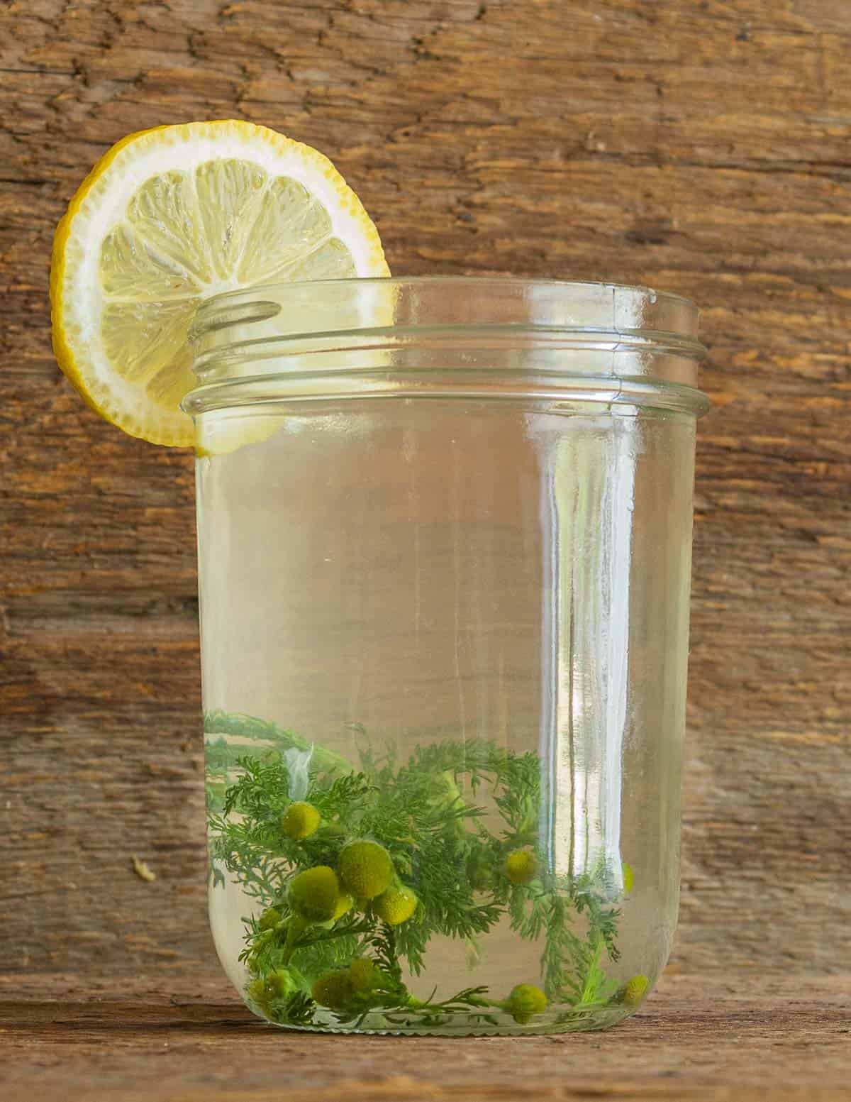 A mason jar full of pineapple weed lemonade. 