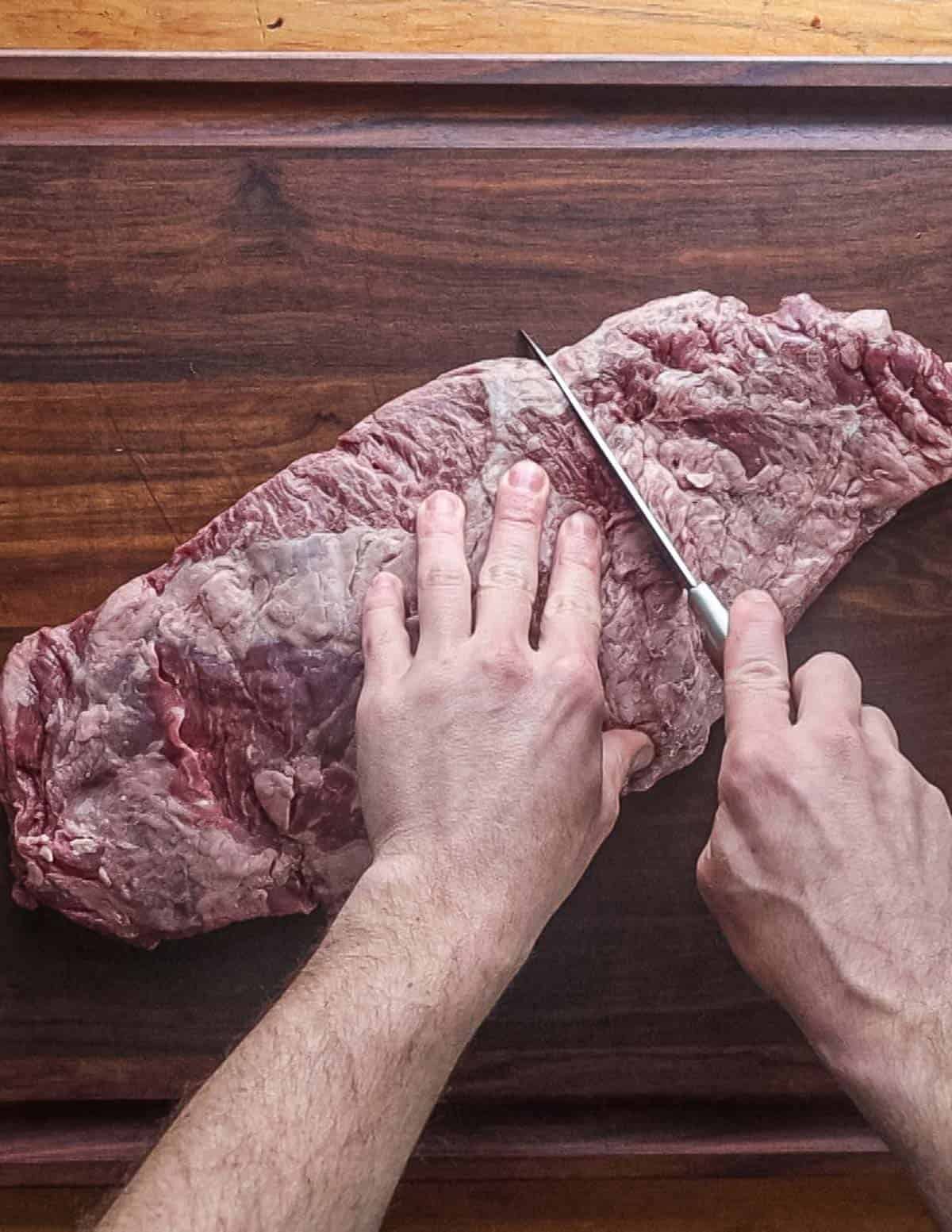 Cutting a whole bavette steak.