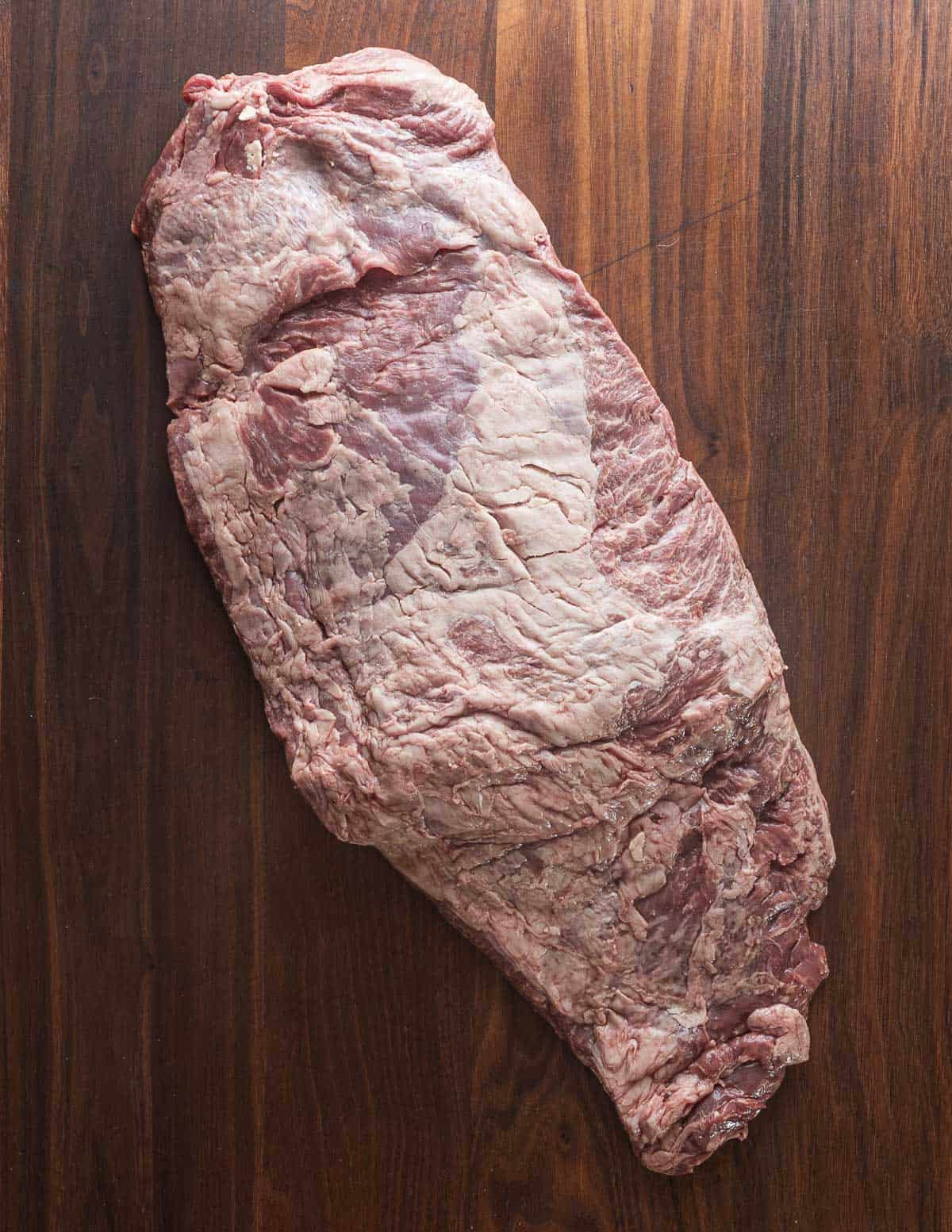 A whole untrimmed bavette steak.