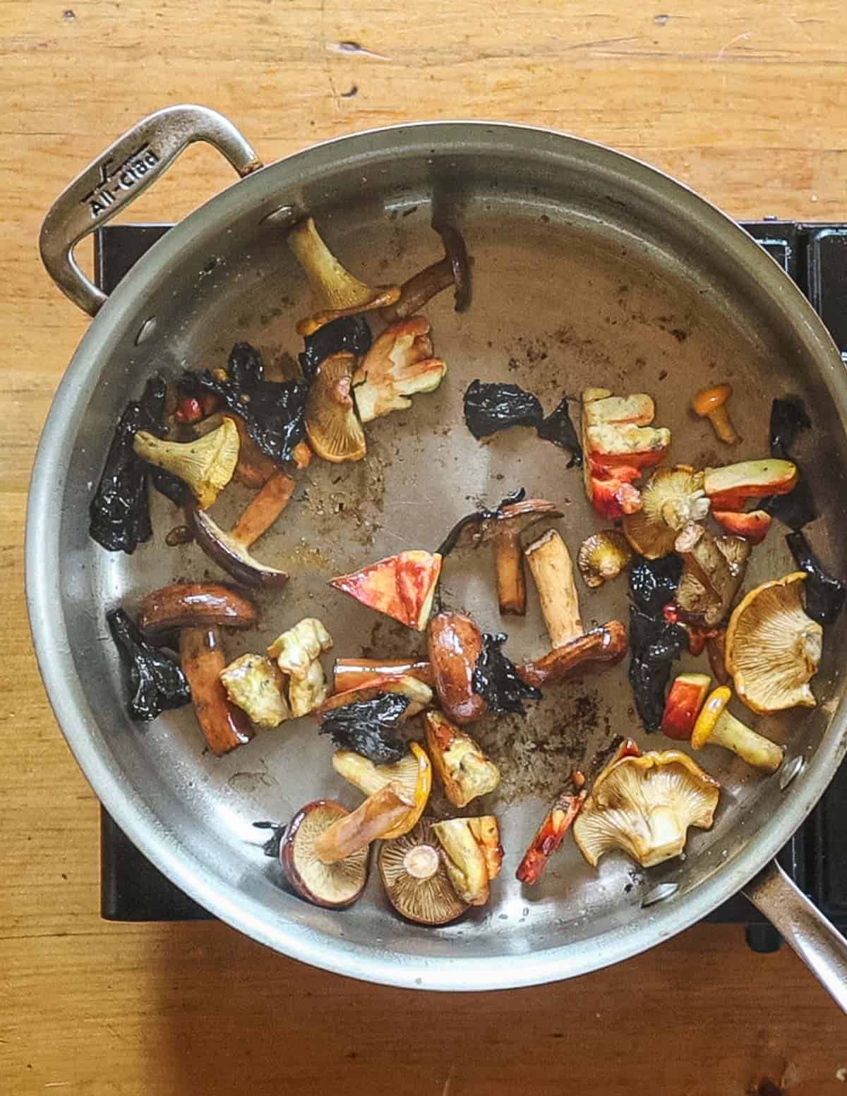 A pan of cooked wild mushrooms. 
