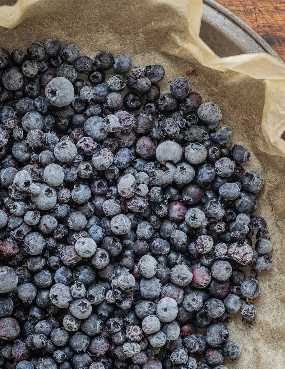 Frozen wild blueberries on a plate. 